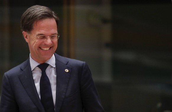 Dutch Prime Minister Mark Rutte smiles during a round table meeting at an EU summit in Brussels, Tuesday, July 21, 2020. Weary European Union leaders are expressing cautious optimism that a deal is in ...