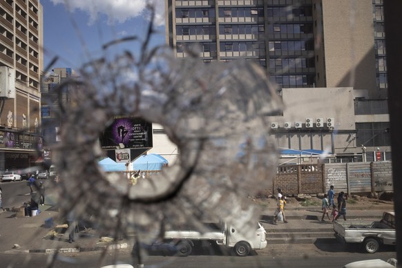 epa09064755 A bullet hole is seen in one of the windows at the newly refurbished Fight with Insight project boxing gym in the notoriously dangerous Hillbrow area of Johannesburg, South Africa, 08 Marc ...