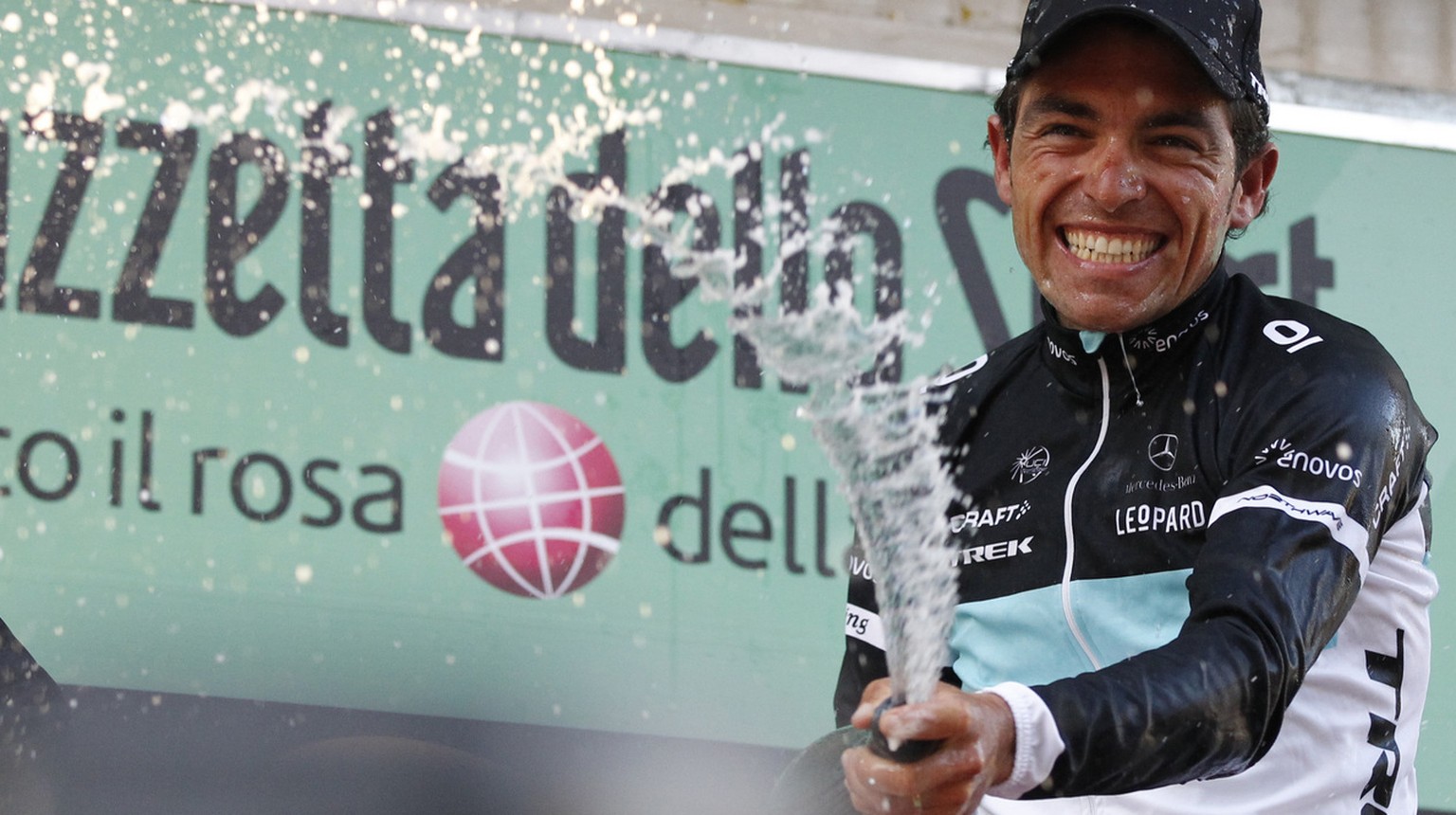 Oliver Zaugg of Switzerland sprays sparkling wine as he celebrates on the podium after winning the Tour of Lombardy cycling race in in Lecco, Italy, Saturday, Oct.15, 2011. Zaugg of Switzerland claime ...