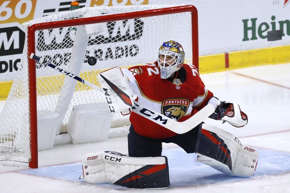 Florida Panthers goaltender Sergei Bobrovsky deflects a shot during the second period of the team&#039;s preseason NHL hockey game against the Tampa Bay Lightning, Thursday, Sept. 26, 2019 in Sunrise, ...