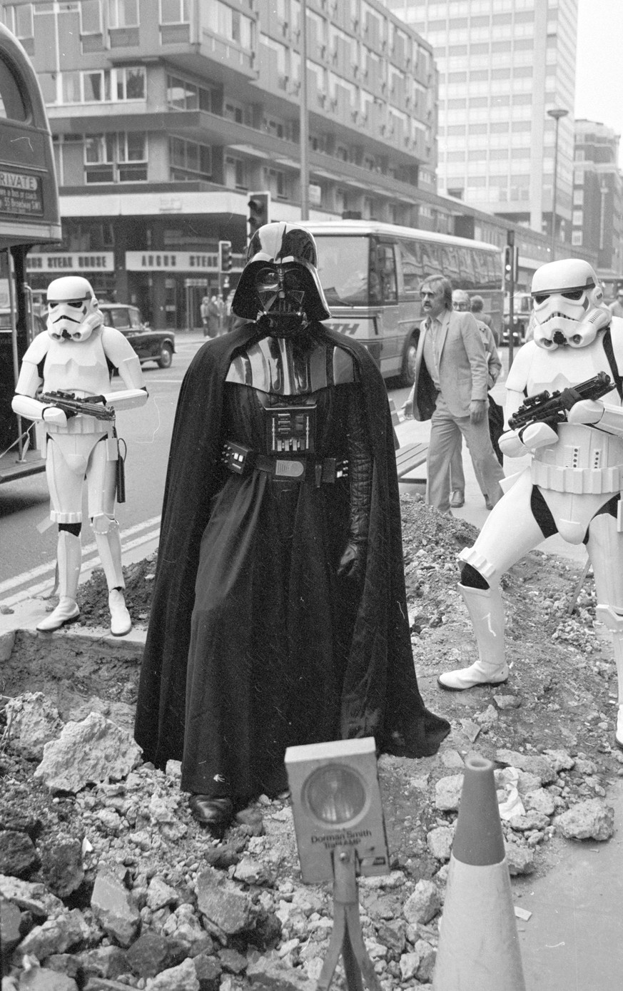 Darth Vader
31st March 1980: Darth Vader and two stormtroopers from the film &#039;Star Wars&#039; stand menacingly over some road works in London&#039;s Oxford Street. (Photo by Central Press/Getty I ...