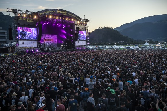 Festival goers enjoy the concert of the US band Dropkick Murphys, on the main stage (Jungfrau stage), during the Greenfield Openair Festival, Thursday, June 13, 2019, in Interlaken, Switzerland. The f ...