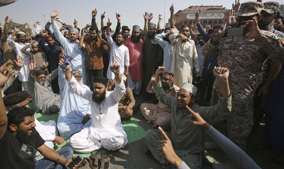 Supporters of a Pakistani religious group chant slogans while block a main road at a protest after a court decision, in Karachi, Pakistan, Wednesday, Oct. 31, 2018. Pakistan&#039;s top court has acqui ...