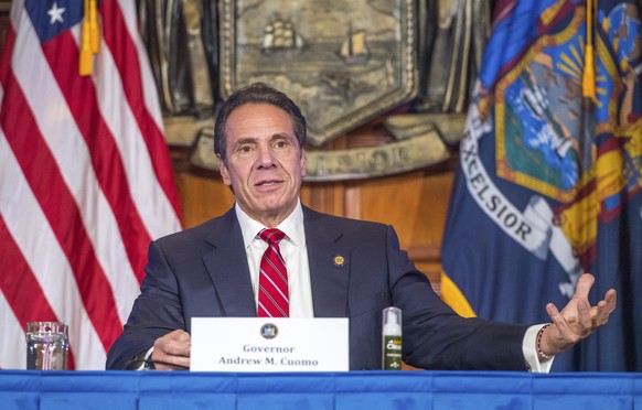 In this Wednesday, Nov. 18, 2020 photo provided by the Office of Governor Andrew M. Cuomo, Gov. Cuomo holds a press briefing on the coronavirus in the Red Room at the State Capitol in Albany, N.Y. Dur ...