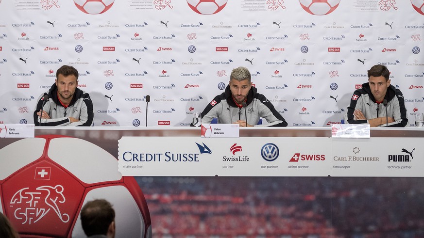 Haris Seferovic, Valon Behrami and Fabian Schaer, from left, speak during a press conference of Switzerland&#039;s national soccer team at the St. Jakob-Park stadium in Basel, Switzerland, on Tuesday, ...