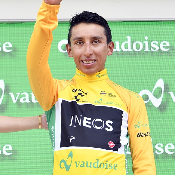 epa07666448 Colombian rider Egan Bernal (R) of Team Ineos celebrates on the podium next to former Miss Switzerland Linda Faeh (L) after the eigth stage of the 83rd Tour de Suisse UCI ProTour cycling r ...