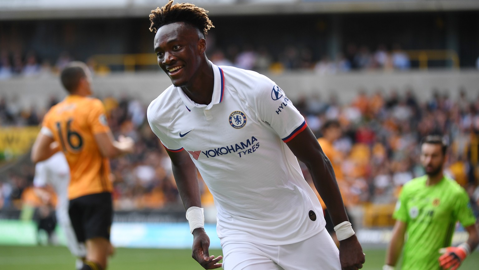 epa07842478 Chelsea&#039;s Tammy Abraham celebrates after scoring his teams fourth goal against Wolves during an English Premier League soccer match at Molineux in Wolverhampton, Britain, 14 September ...