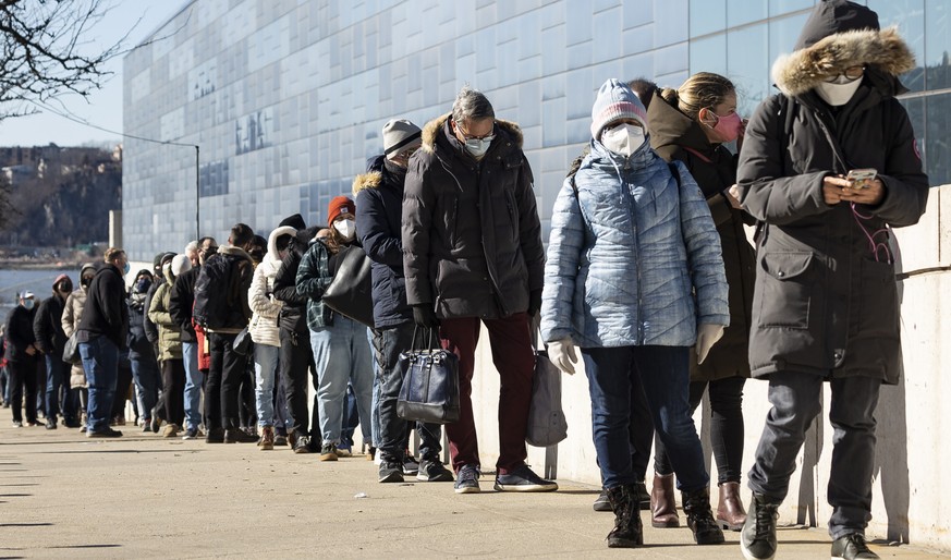 epa09047218 People wait in line to receive COVID-19 vaccinations at a vaccination site set up in the Jacob K. Javits Convention Center in New York, New York, USA, 02 March 2021. The United States is t ...