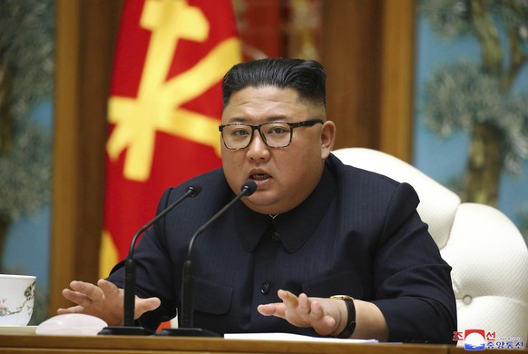FILE - In this Saturday, April 11, 2020, file photo provided by the North Korean government, North Korean leader Kim Jong Un attends a politburo meeting of the ruling Workers&#039; Party of Korea in P ...