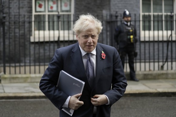 British Prime Minister Boris Johnson leaves 10 Downing Street in London, to attend a weekly cabinet meeting at the Foreign, Commonwealth &amp; Development Office, in London, Tuesday, Nov. 10, 2020. (A ...
