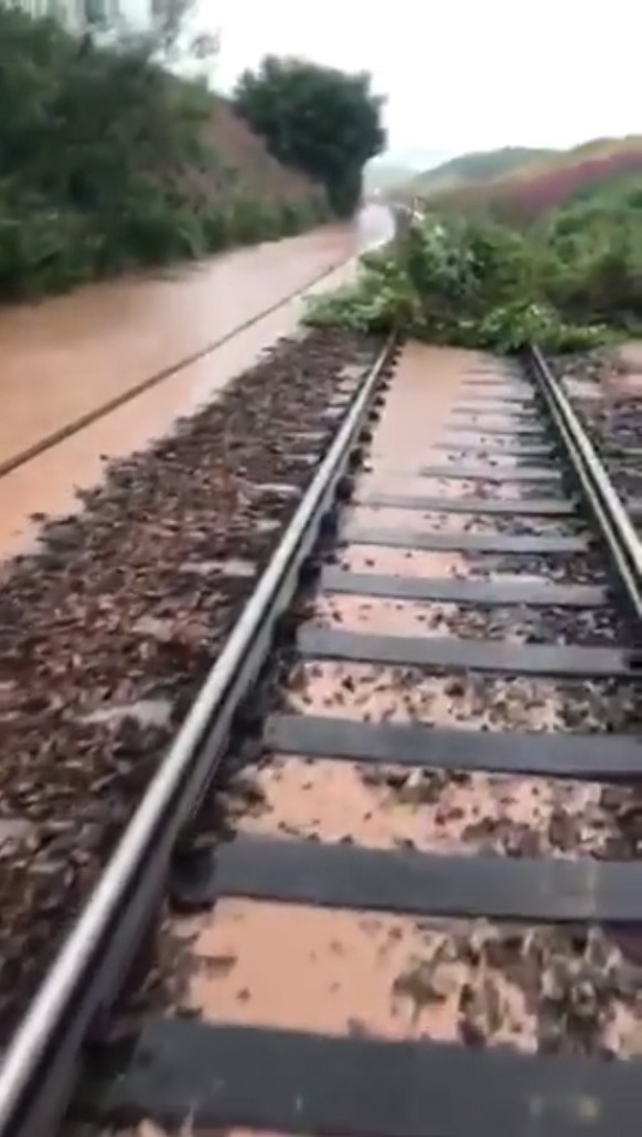 epa08599297 A picture taken from handout video made available by Network Rail Scotland shows flooding and a landslip on the rail line between Aberdeen and Dundee, near Carmont, Stonehaven, Scotland, 1 ...