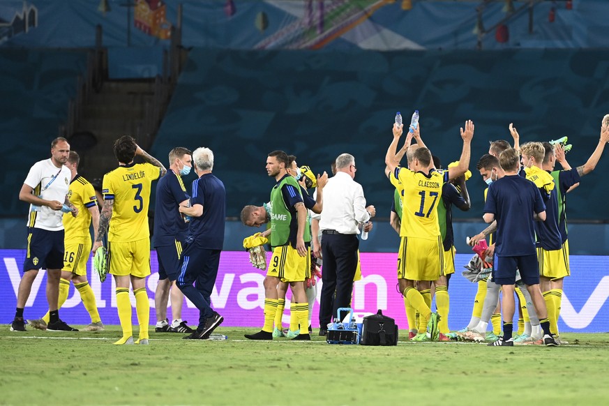 Swedish players cheer to their supporters at the end of the Euro 2020 soccer championship group E match between Spain and Sweden at La Cartuja stadium in Seville, Monday, June 14, 2021. (AP Photo/Pier ...