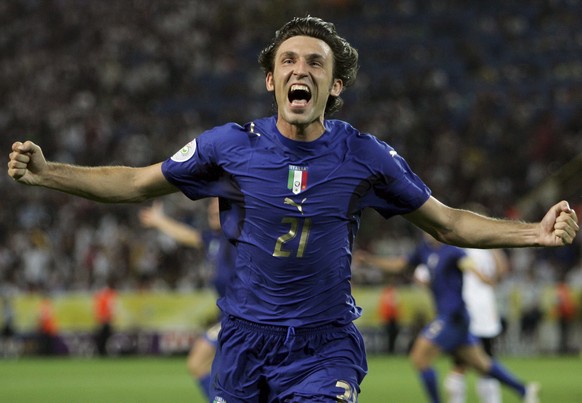 FILE - In this Tuesday, July 4, 2006 filer, Italy&#039;s Andrea Pirlo celebrates his side&#039;s first goal by teammate Fabio Grosso in the extra time of the semifinal World Cup soccer match between G ...