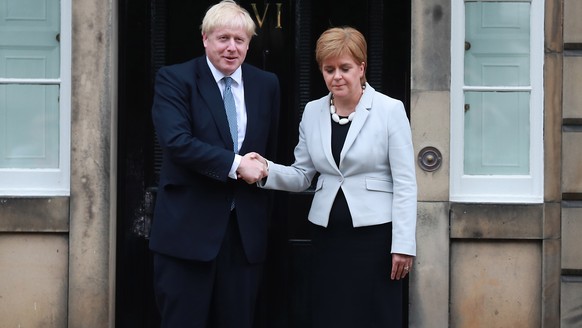 epaselect epa07747761 Prime Minister Boris Johnson (L) meets with Scotlands First Minister Nicola Sturgeon at Bute House, Edinburgh, Scotland, 29 July 2019. EPA/Stewart Attwood