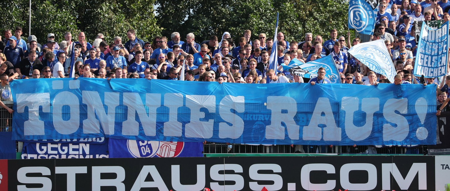 epa07766367 Schalke&#039;s supporters hold a banner reading &#039;Toennies out!&#039; to demonstrate against the chairman of Schalke&#039;s supervisory board, Clemens Toennies, during the German DFB C ...