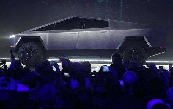 The Tesla Cybertruck is unveiled at Tesla&#039;s design studio Thursday, Nov. 21, 2019, in Hawthorne, Calif. CEO Elon Musk is taking on the workhorse heavy pickup truck market with his latest electric ...