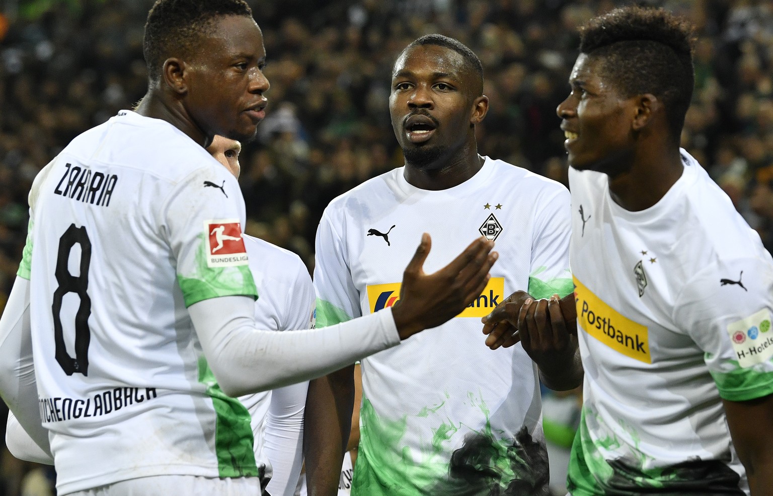 Moenchengladbach&#039;s Marcus Thuram, center, celebrates with Moenchengladbach&#039;s Denis Zakaria, left and Moenchengladbach&#039;s Breel Embolo after scoring his side&#039;s opening goal during th ...