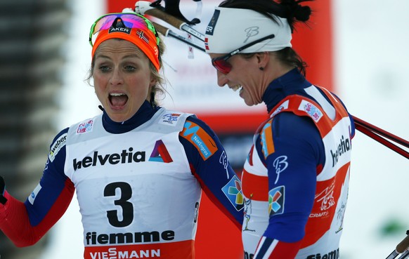 Norway&#039;s Therese Johaug and Marit Bjoergen react after a Tour de Ski, women&#039;s 10 km mass start classic event in Val di Fiemme, Italy, Saturday, ,Jan. 10 , 2014. (AP Photo/Alessandro Trovati)