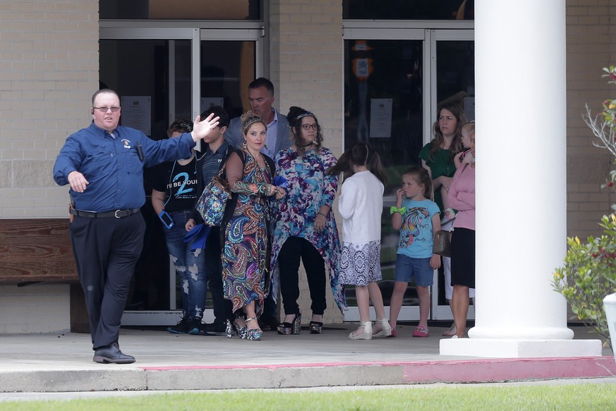 Congregants exit after services at the Life Tabernacle Church in Central, La., Sunday, March 29, 2020. Pastor Tony Spell has defied a shelter-in-place order by Louisiana Gov. John Bel Edwards, due to  ...