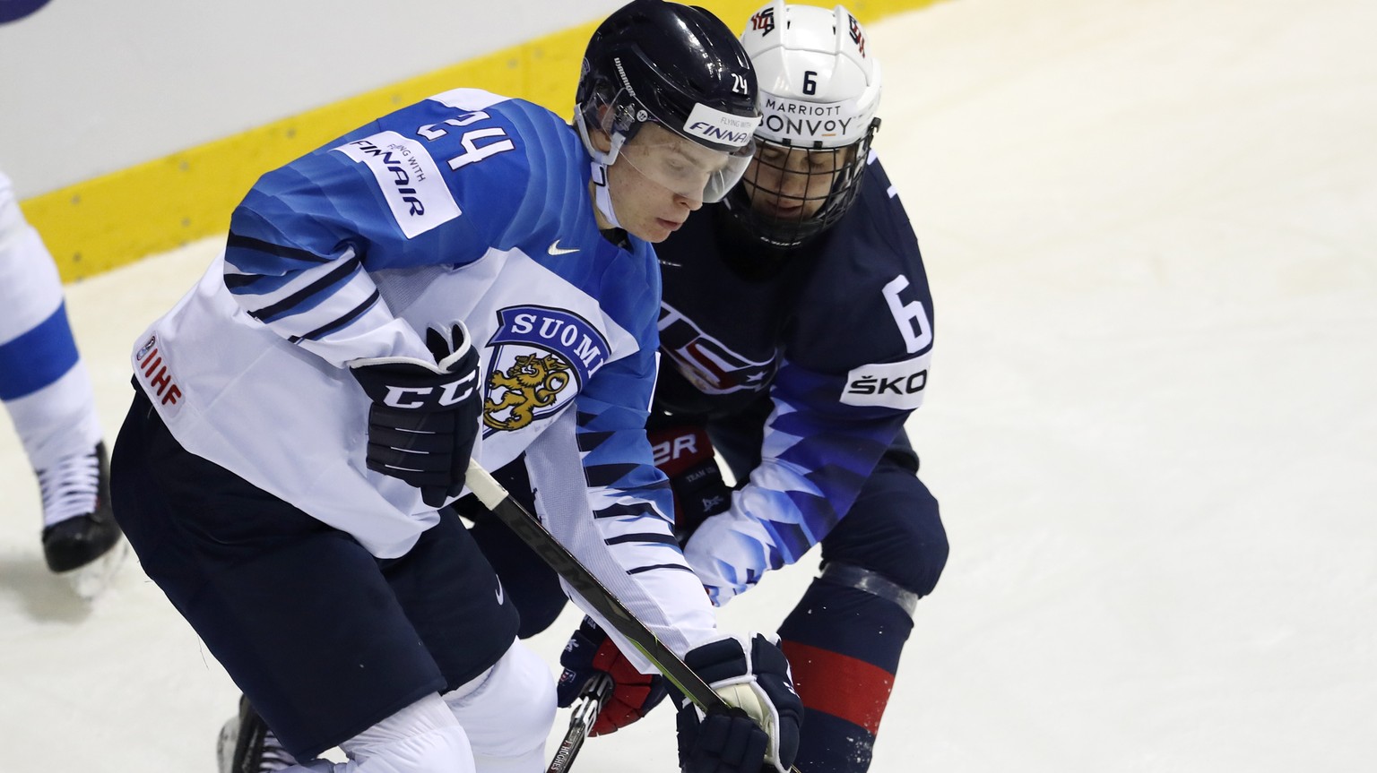 Jack Hughes of the US, right, challenges Finland&#039;s Kaapo Kakko, left, during the Ice Hockey World Championships group A match between the United States and Finland at the Steel Arena in Kosice, S ...