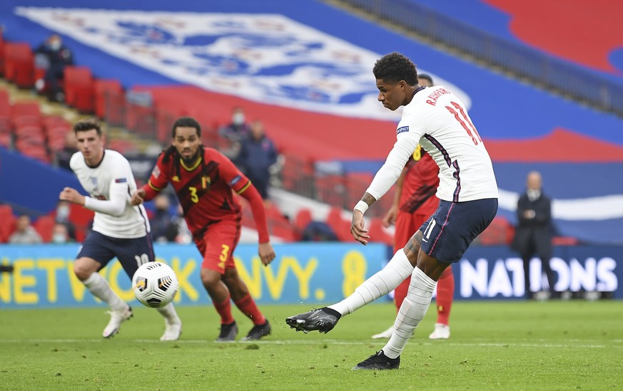 England&#039;s Marcus Rashford scores his side&#039;s first goal from the penalty spot during the UEFA Nations League soccer match between England and Belgium at Wembley stadium in London, Sunday, Oct ...