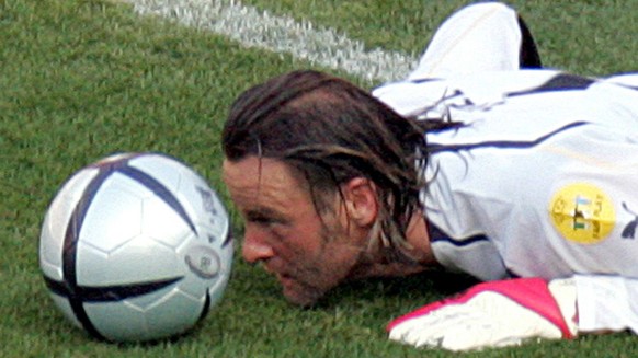 Swiss goalkeeper Joerg Stiel makes an unusual save with his head after the ball slipped through his hands in the first attempt during the EURO 2004 Group B match between Switzerland and Croatia at the ...