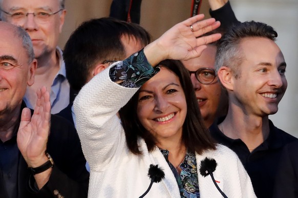 Paris mayor Anne Hidalgo waves before delivering a speech after her victorious second round of the municipal election, Sunday, June 28, 2020 in Paris. France on Sunday held the second round of municip ...