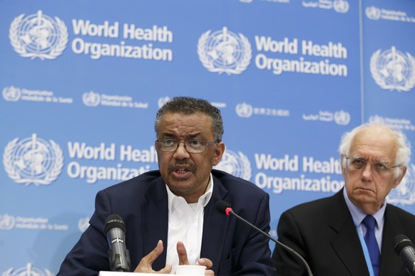 epa08152256 Tedros Adhanom Ghebreyesus (L), Director General of the World Health Organization (WHO), and Professor Didier Houssin (R), Chair of Emergency Committee, talk to the media after the he WHO& ...