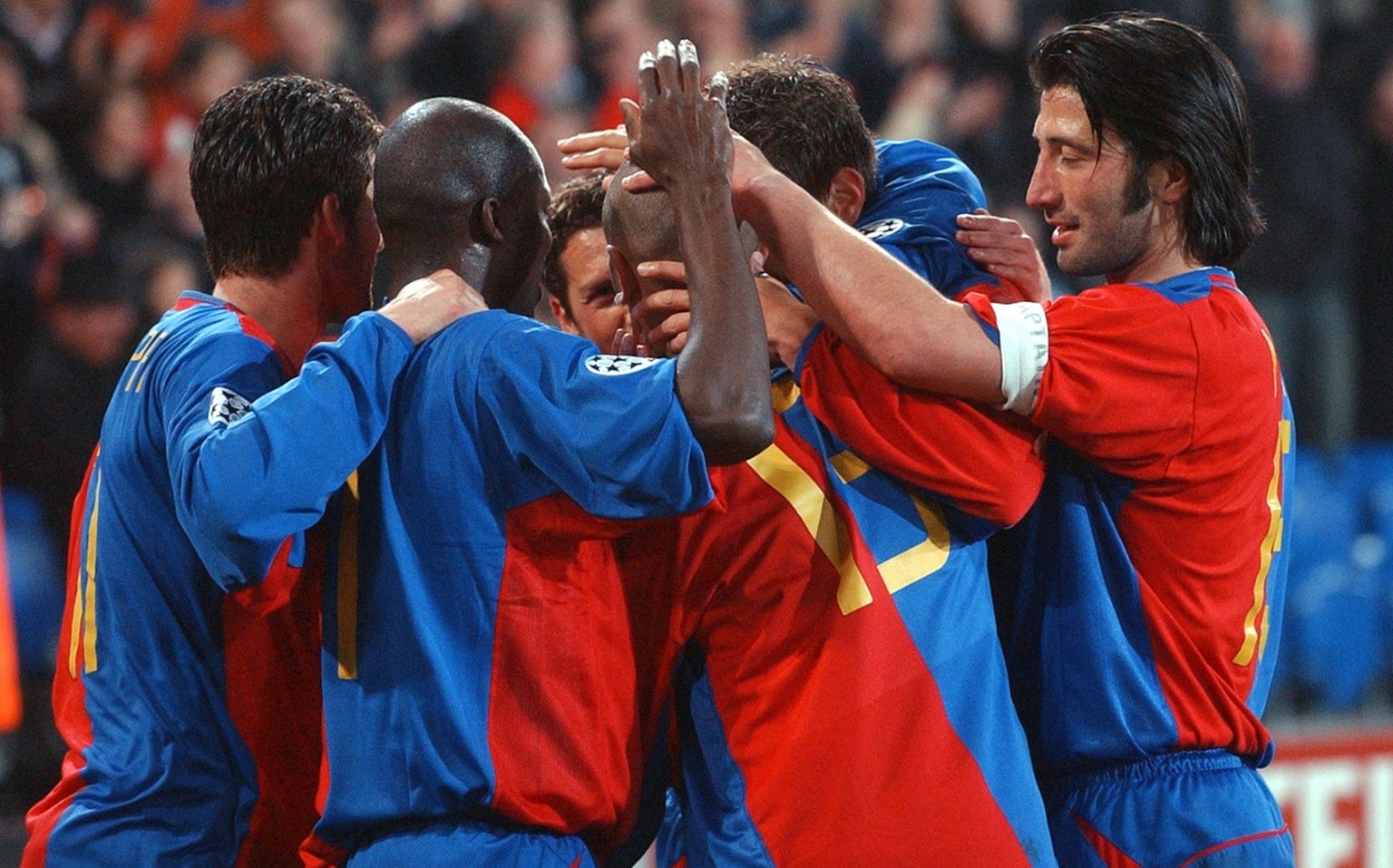 Basel&#039;s players congratulate Christian Gimenez, Nr. 13, after he scored the second goal for Basel, Tuesday, March 18, 2003, during the Champions League soccer match between FC Basel and Juventus  ...