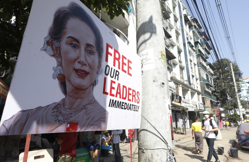 epa09053023 A banner calling for the release of detained civilian leader Aung San Suu Kyi is displayed on the street during a protest against the military coup in Yangon, Myanmar, 05 March 2021. Anti- ...