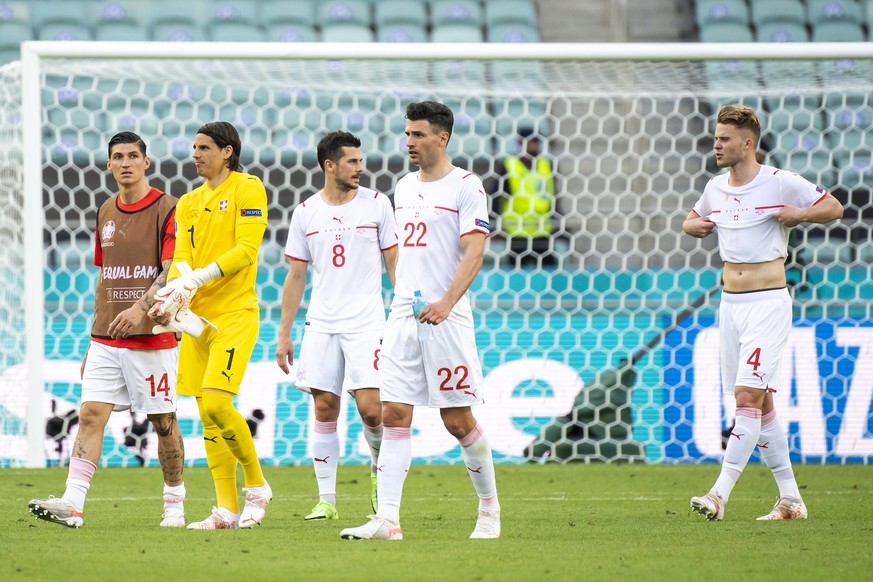 epa09264977 Players of Switzerland walk off the pitch after the UEFA EURO 2020 group A preliminary round soccer match between Wales and Switzerland in Baku, Azerbaijan, 12 June 2021. EPA/JEAN-CHRISTOP ...