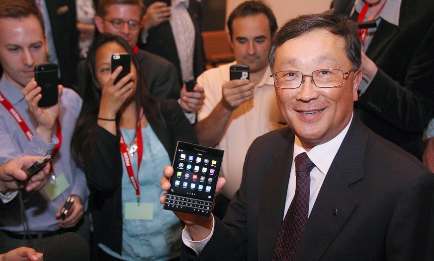 BlackBerry CEO John Chen shows off the new Passport phone after the company&#039;s annual general meeting in Waterloo, Ontario, Thursday June 19, 2014. (AP Photo/The Canadian Press, Dave Chidley)