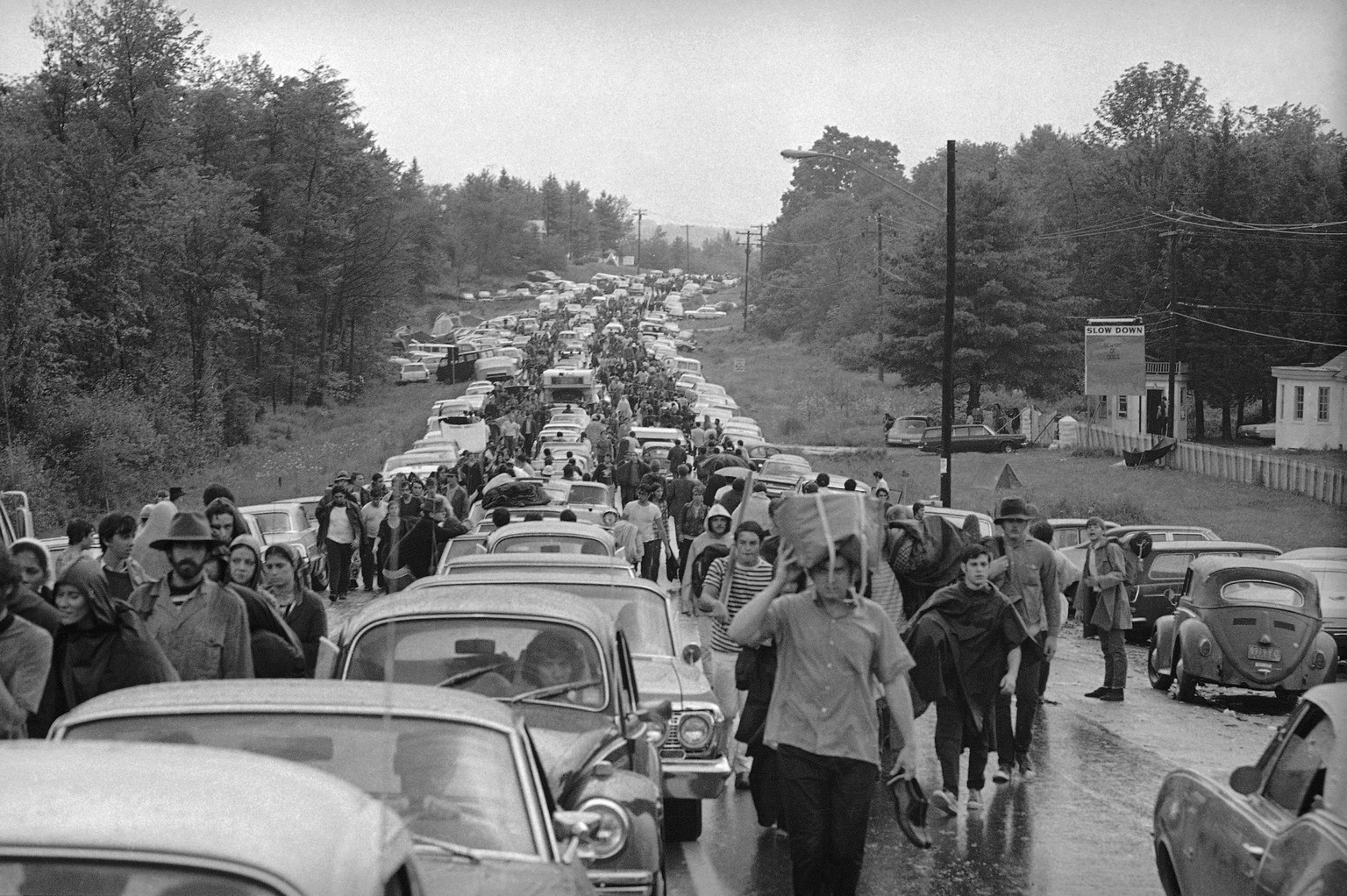 FILE - In this Aug. 16, 1969 file photo, hundreds of rock music fans jam a highway leading from Bethel, N.Y., as they try to leave the Woodstock Music and Art Festival. More than 400,000 people attend ...