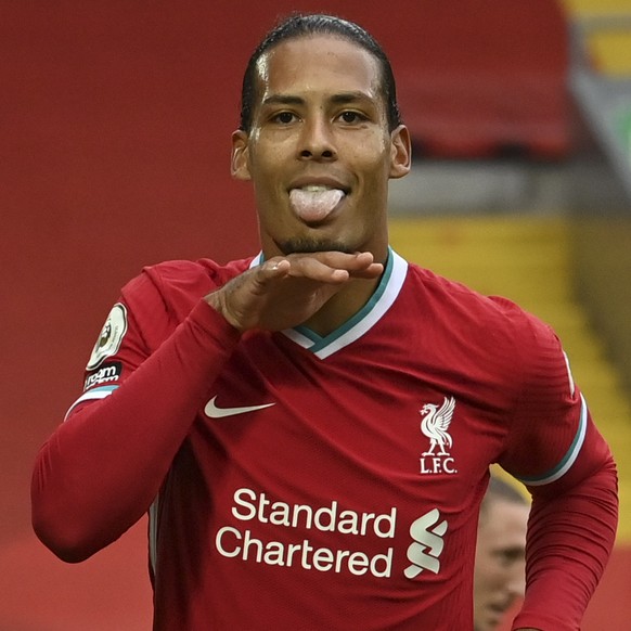 Liverpool&#039;s Virgil van Dijk, left, celebrates after he scored his side&#039;s second goal during the English Premier League soccer match between Liverpool and Leeds United, at the Anfield stadium ...
