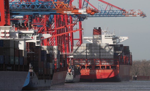 epa09033422 Container ships at the port of Hamburg, northern Germany, 24 February 2021. Customs authorities announced that they have seized more than 16 tonnes of cocaine hidden in three containers at ...