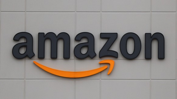 FILE - The Amazon DTW1 fulfillment center is shown in Romulus, Mich., April 1, 2020. Big Tech companies reported mixed quarterly earnings on Thursday, July 30, 2020, a day after their top executives f ...