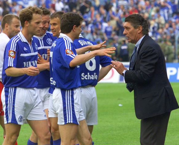 The manager of Schalke, Rudi Assauer, right, discusses whether or not the team won the German Championship with Andreas Moeller, Ebbe Sand and Niels Oude Kamphuis, from right to left, after the German ...