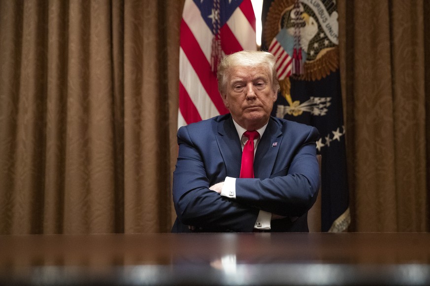 President Donald Trump listens during a roundtable discussion with African-American supporters in the Cabinet Room of the White House, Wednesday, June 10, 2020, in Washington. (AP Photo/Patrick Semans ...