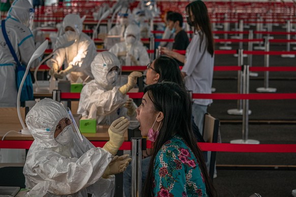 epaselect epa08505104 People are tested for COVID-19 at a makeshift coronavirus testing center, in Beijing, China, 24 June 2020. Almost three million of people were tested for COVID-19 in Beijing as t ...