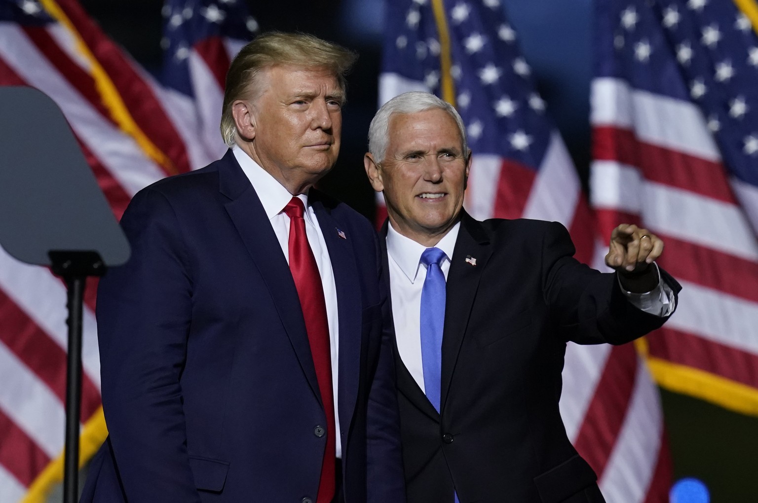 President Donald Trump, left, and Vice President Mike Pence look to the crowd during a campaign rally Friday, Sept. 25, 2020, in Newport News, Va. (AP Photo/Steve Helber)
Donald Trump,Mike Pence