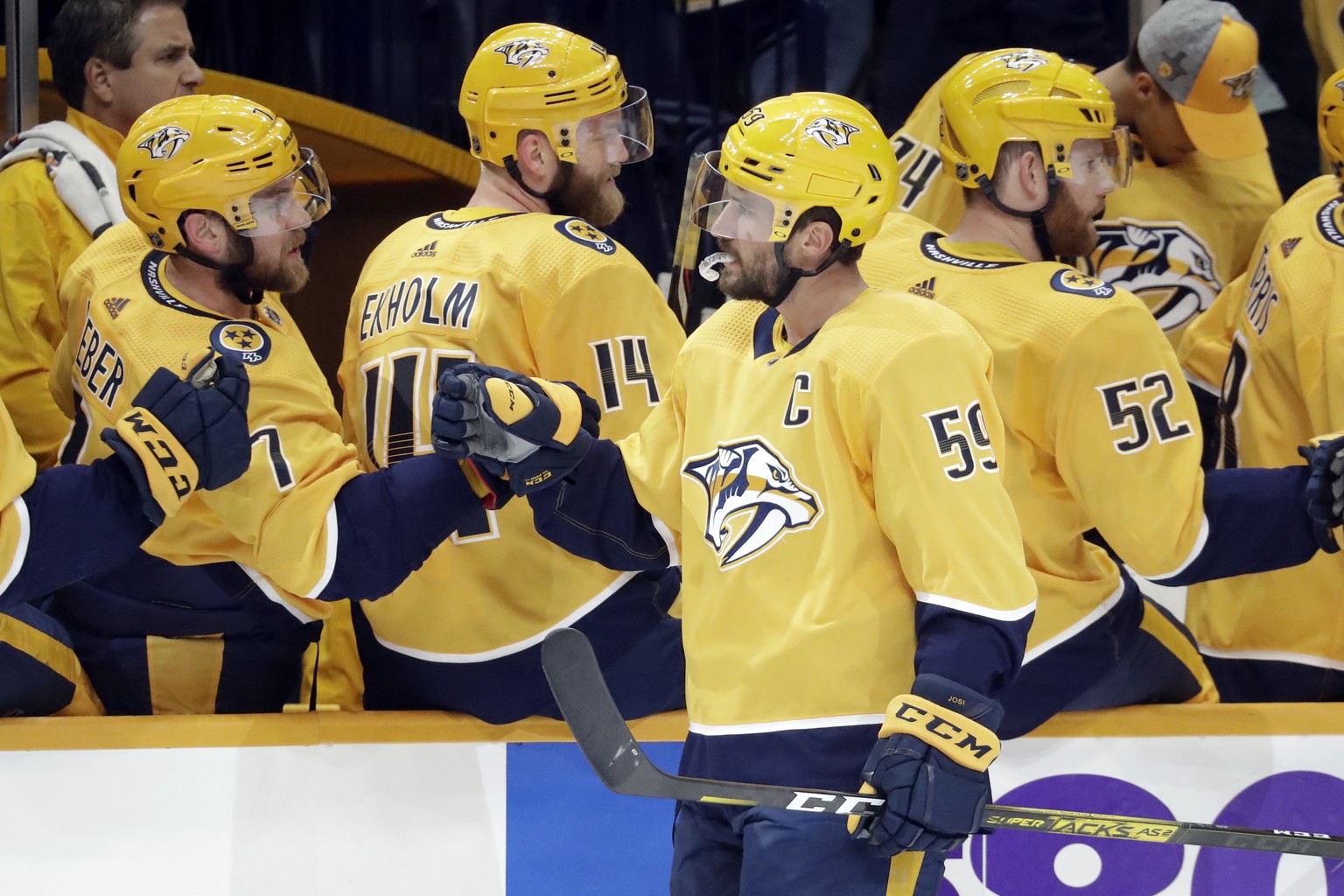 Nashville Predators defenseman Roman Josi (59), of Switzerland, is congratulated after scoring a goal against the San Jose Sharks during the first period of an NHL hockey game Tuesday, Oct. 8, 2019, i ...