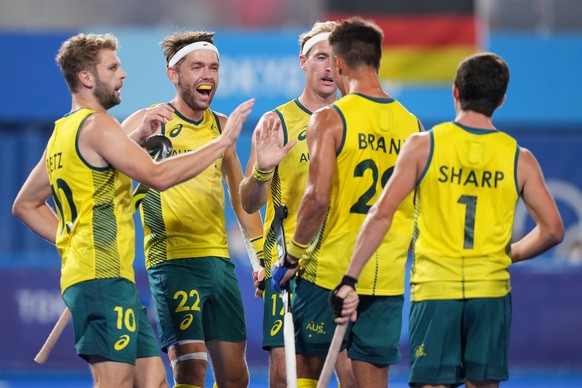 epa09390938 Team Australia players celebrate their opening goal during the Men&#039;s Field Hockey Semifinals match between Australia and Germany at the Tokyo 2020 Olympic Games at Oi Hockey Stadium i ...