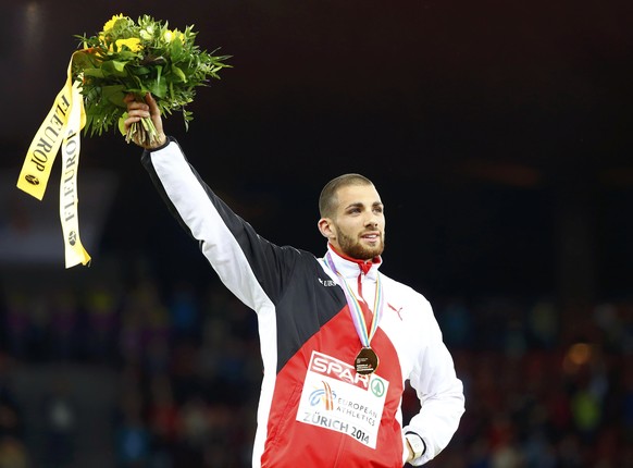 Gold medallist Kariem Hussein of Switzerland celebrates during the winners ceremony for the men&#039;s 400 metres hurdles during the European Athletics Championships at the Letzigrund Stadium in Zuric ...