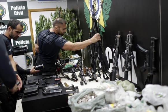 Weapons and drugs seized during a police raid are displayed for the press at city police headquarters in Rio de Janeiro, Brazil, Thursday, May 6, 2021. According to the press office of Rio&#039;s civi ...