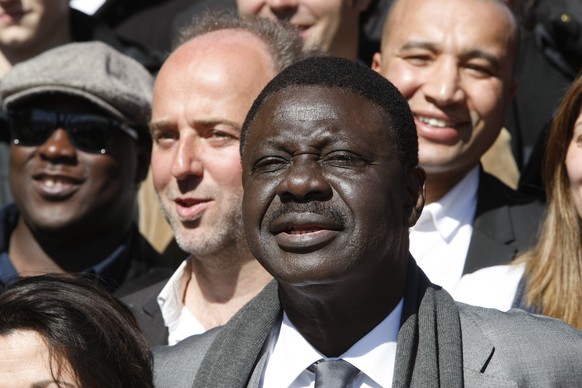 Former president of Olympic Marseille soccer club Pape Diouf, center, and candidate for the upcoming municipal elections in 2014, with fellow candidates during his electoral campaign, on the Old-Port, ...