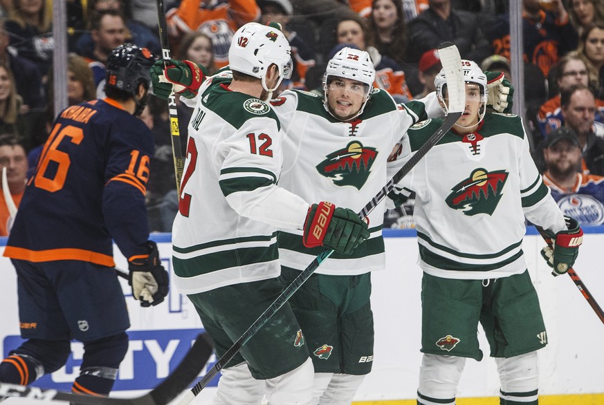 Minnesota Wild&#039;s Eric Staal (12), Kevin Fiala (22) and Jared Spurgeon (46) celebrate a goal against the Edmonton Oilers during the first period of an NHL hockey game Friday, Feb. 21, 2020, in Edm ...