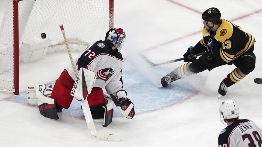 Boston Bruins center Charlie Coyle (13) beats Columbus Blue Jackets goaltender Sergei Bobrovsky (72) for the game-winning goal during overtime of Game 1 of an NHL hockey second-round playoff series, T ...
