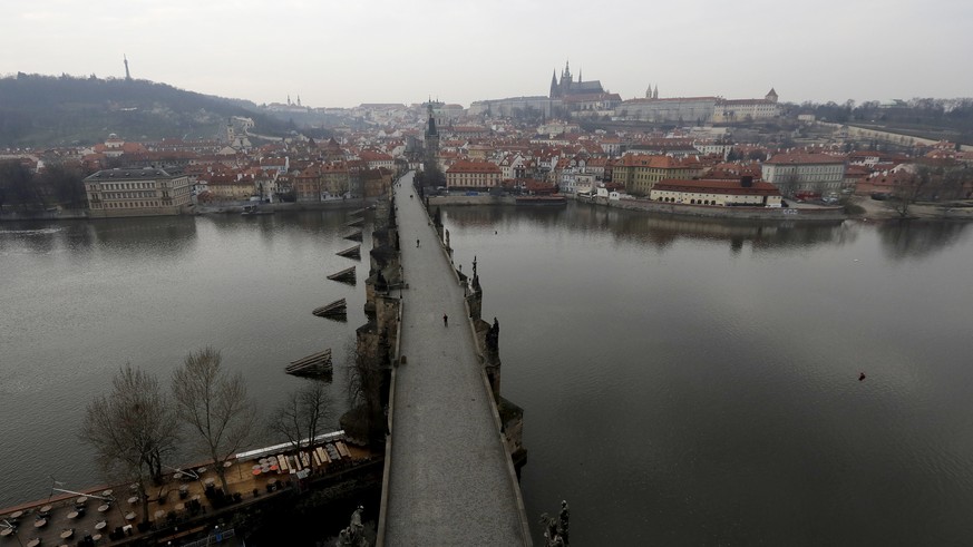 A view of the near empty Charles Bridge in Prague, Czech Republic, Friday, March 20, 2020. The Czech Republic&#039;s government has approved further dramatic measures to try and stem the spread of the ...