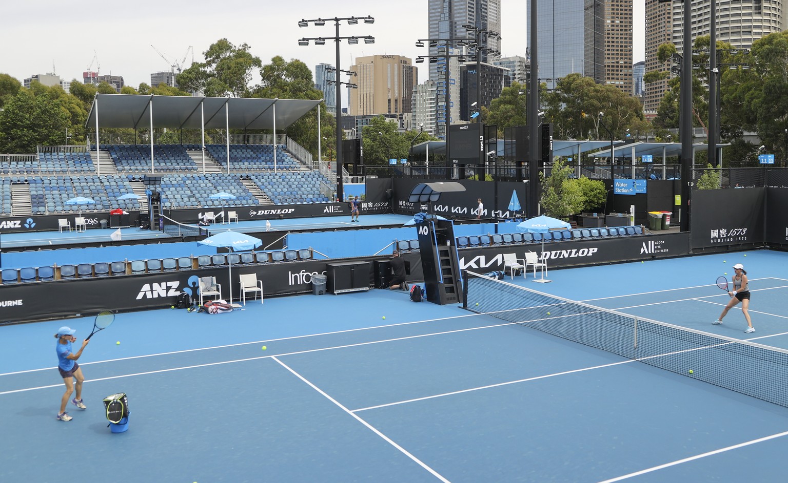 Players practice on outside courts at Melbourne Park, venue for the Australian Open tennis championships in Melbourne, Australia, Thursday, Feb. 4, 2021. All competition at six Australian Open tuneup  ...