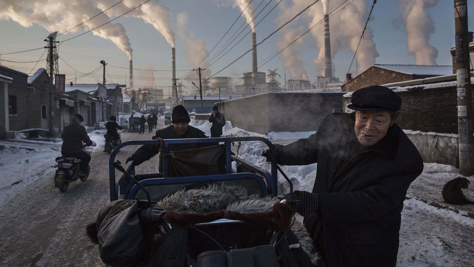 In this image released by World Press Photo titled &quot;China&#039;s Coal Addiction&quot; by photographer Kevin Frayer for Getty Images which won first prize in the Daily Life singles category shows  ...